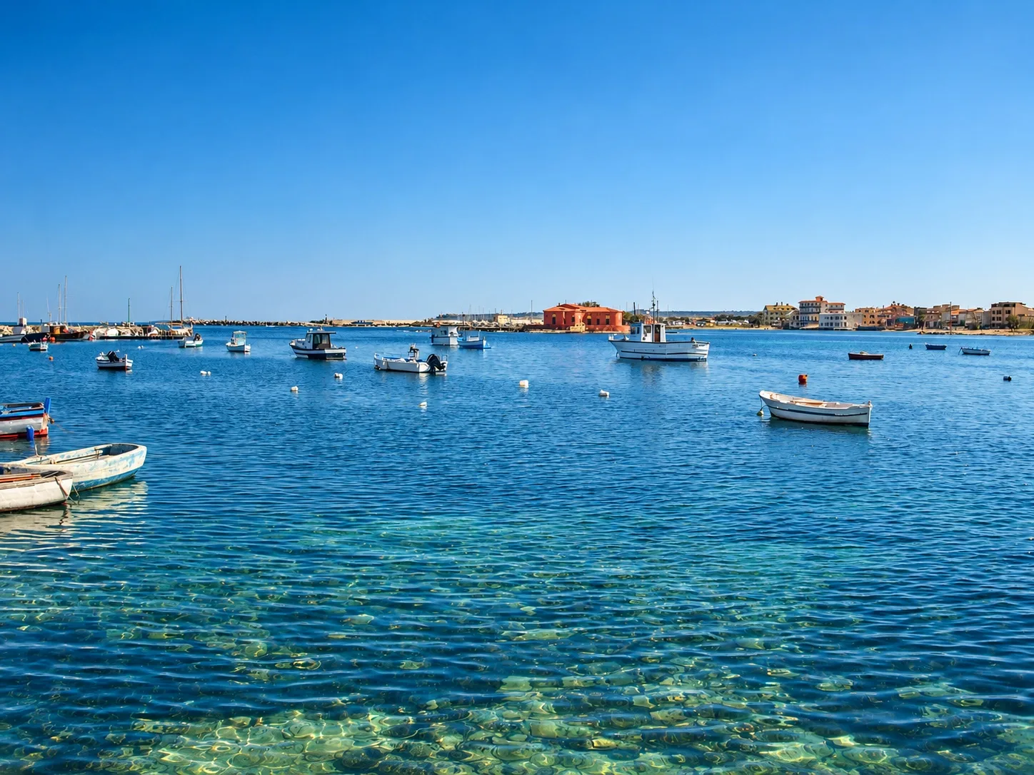 Marzamemi’s small harbour with the tuna fishery in the background